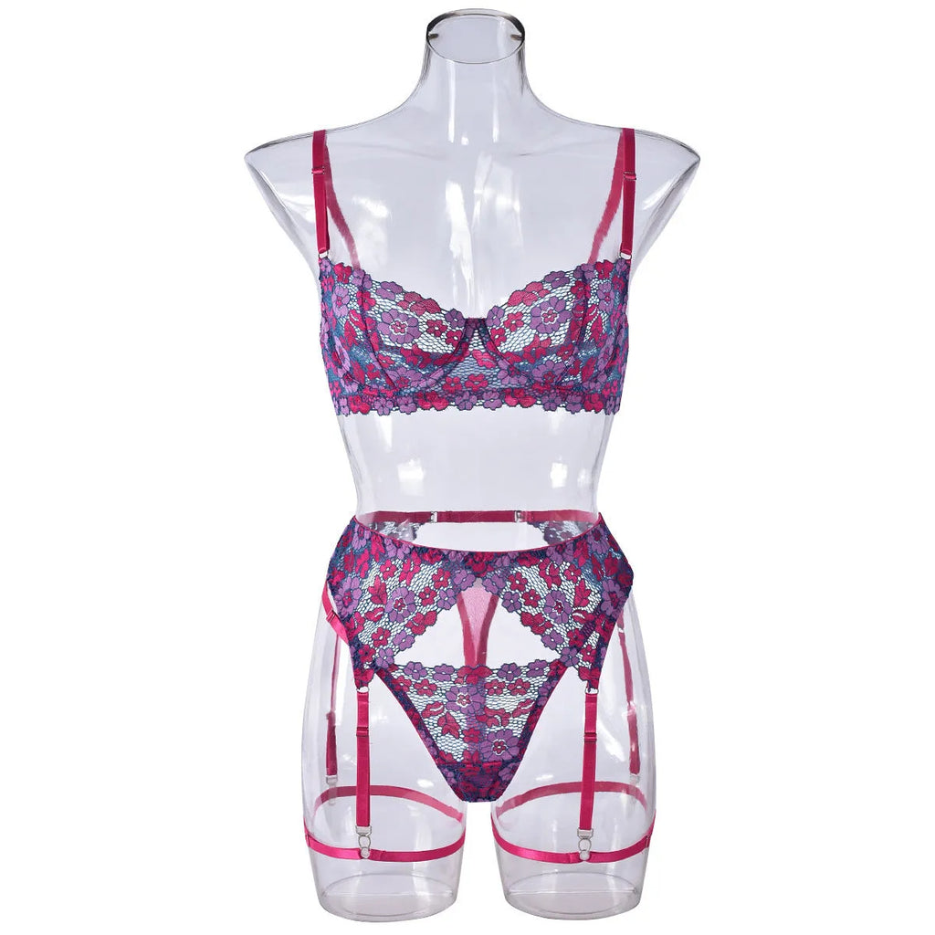 Rose red women's bikini swimwear set with embroidered contrast colour detail on mannequin