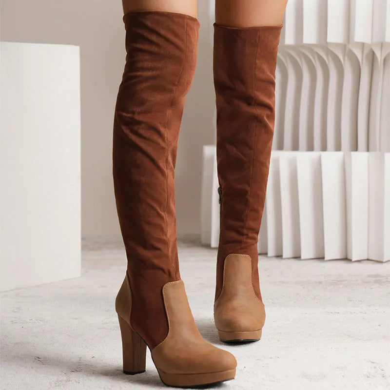 Black suede over-the-knee boots with a high square heel and round toe