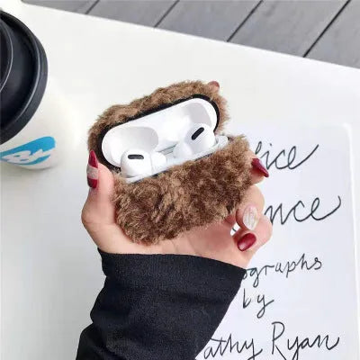 Green plush plastic headphone cover for Apple AirPods showing creative design elements