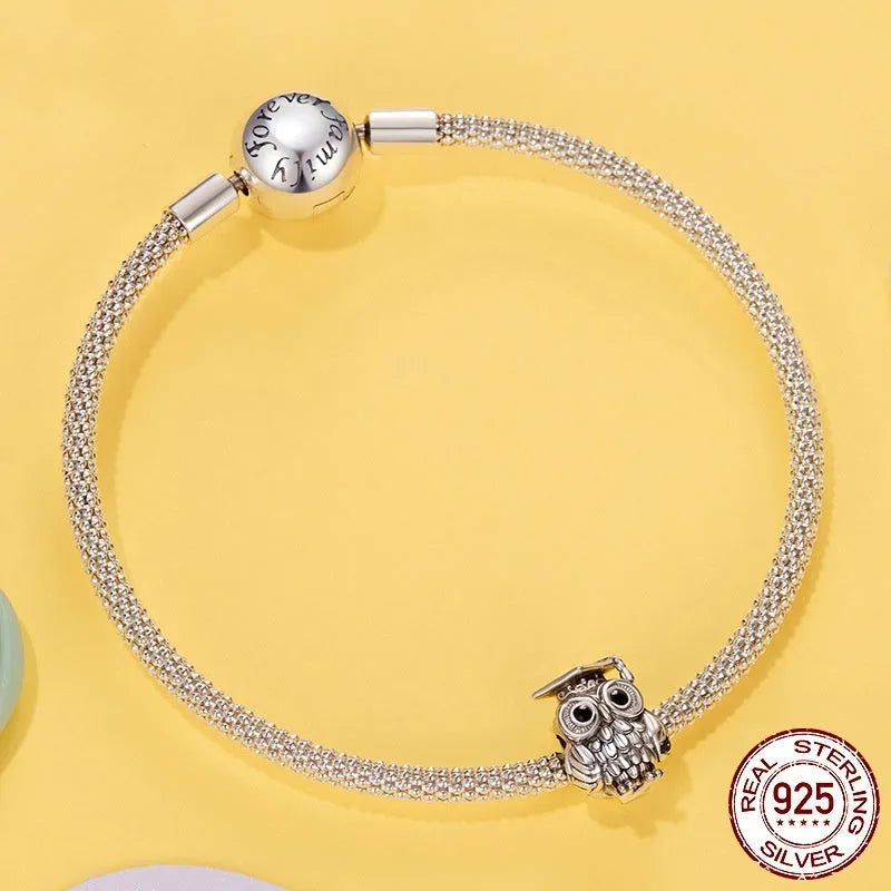 Silver S925 sterling silver owl bead with drip oil finish on white background