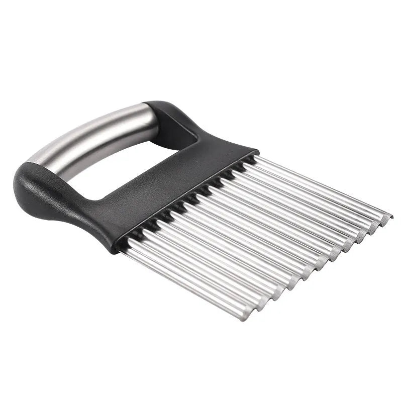 Stainless steel potato wave knife with wavy blade on a kitchen counter.