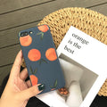 Orange matte finish TPU silicone case for iPhone on a table.