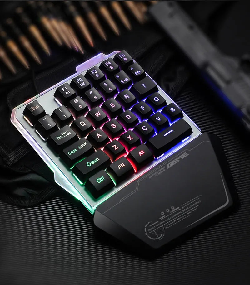 Black robotic one-handed keyboard with RGB backlit keys and a USB cable.