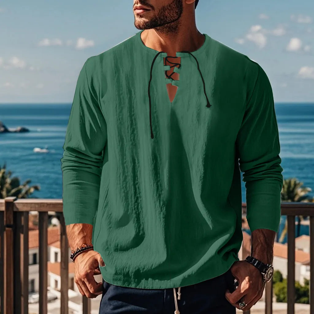 Man wearing a loose fit solid colour cotton linen beach shirt in a casual setting.