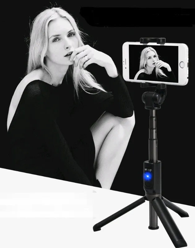Aluminium Bluetooth selfie stick with tripod base and remote control next to a smartphone