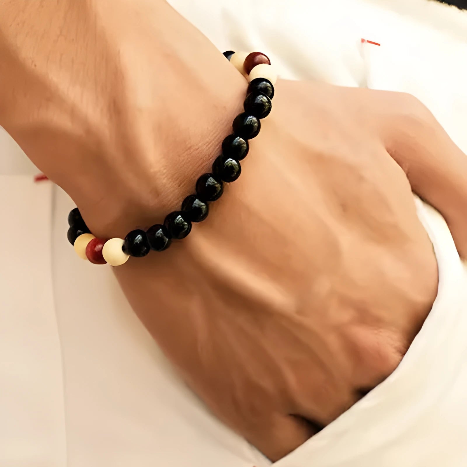 Natural stone bead bracelet with lava stones on a wrist