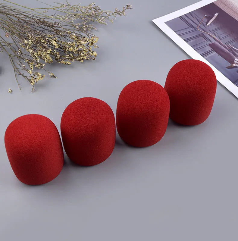 Four multicoloured foam microphone windshields for ball-shaped handheld stage microphones