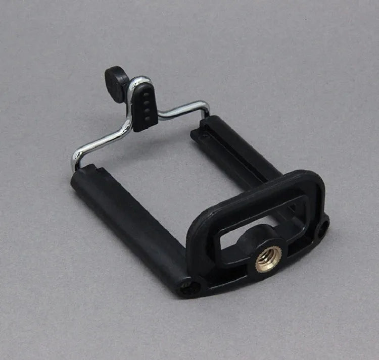 Black octopus tripod with eight flexible rubber legs and a spherical gimbal head for mounting cameras and phones.