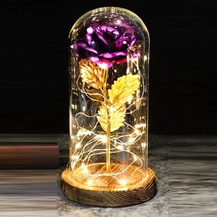 Artificial silk rose LED ornament with glass lampshade showing warm white lights, available in multiple colours.