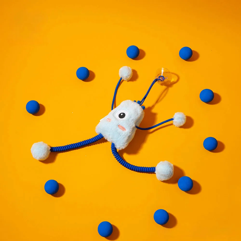 Blue plush elastic cat toy with bell in a ring shape on a light background
