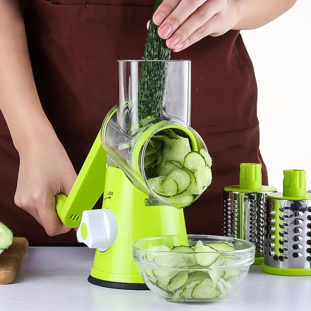 Round mandoline vegetable slicer with three stainless steel blades and suction cup base