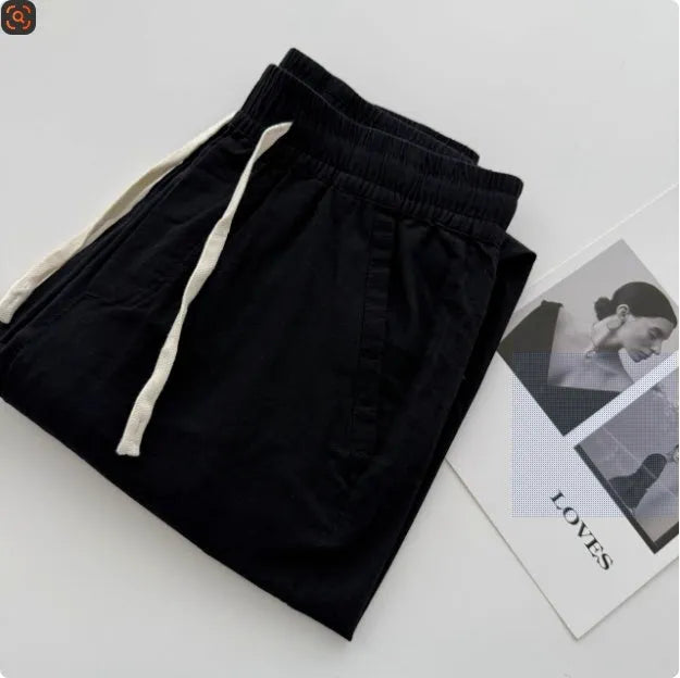 Men's loose straight casual pants in beige colour with drawstring waist detail for summer wear