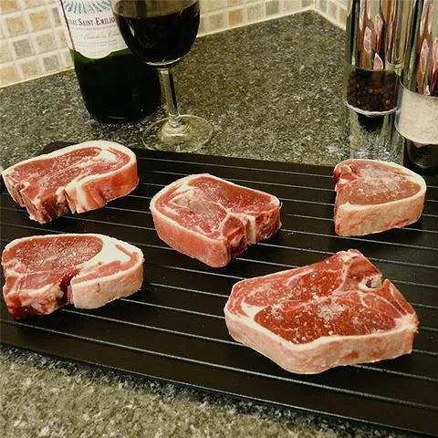 Black aluminium quick defrosting tray for thawing meat and frozen food without electricity.
