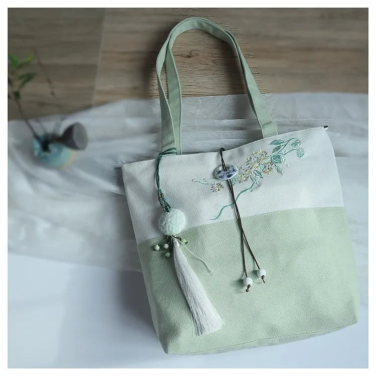 Artistic retro canvas shoulder handbag with hand-painted literary design and copper zipper