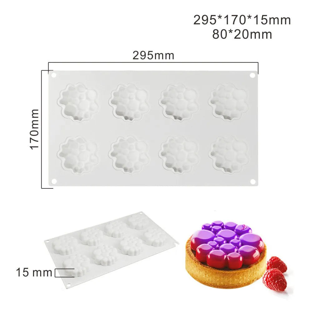 Round silicone cake mould with 8 raised bubble towers for tiered desserts.