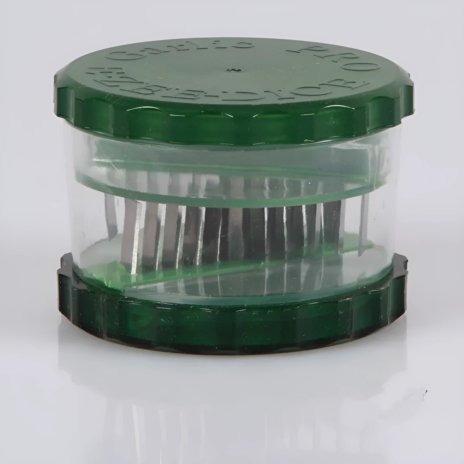 Green transparent polypropylene garlic peeler kitchen tool measuring 8.5 by 8.5 by 6 cm.
