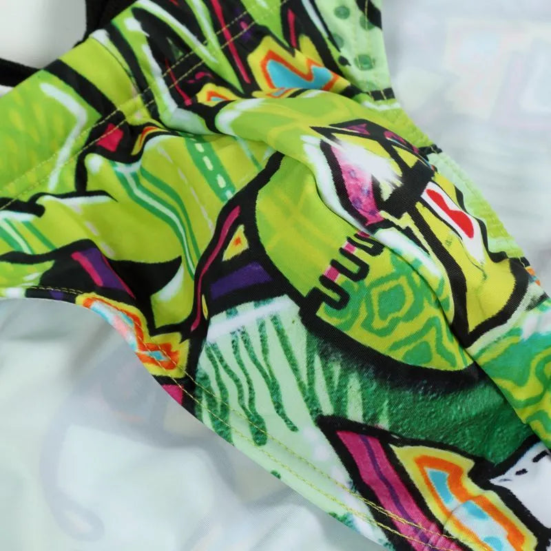 Men's printed swimming trunks in polyester fabric showing Cyber, Ice Cream, Streamer, and Skull design options.