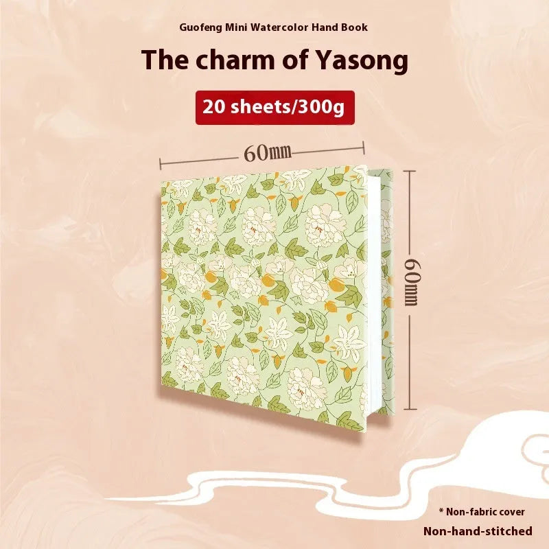 Feiluniao handmade fabric watercolour notebook with illustrated cover, open to show blank paper pages.