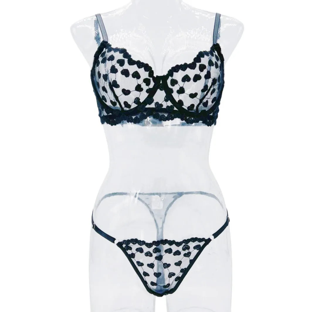 Women's black mesh two-piece suit with romantic multi-colour love print, showing V-neck top and straight-leg trousers