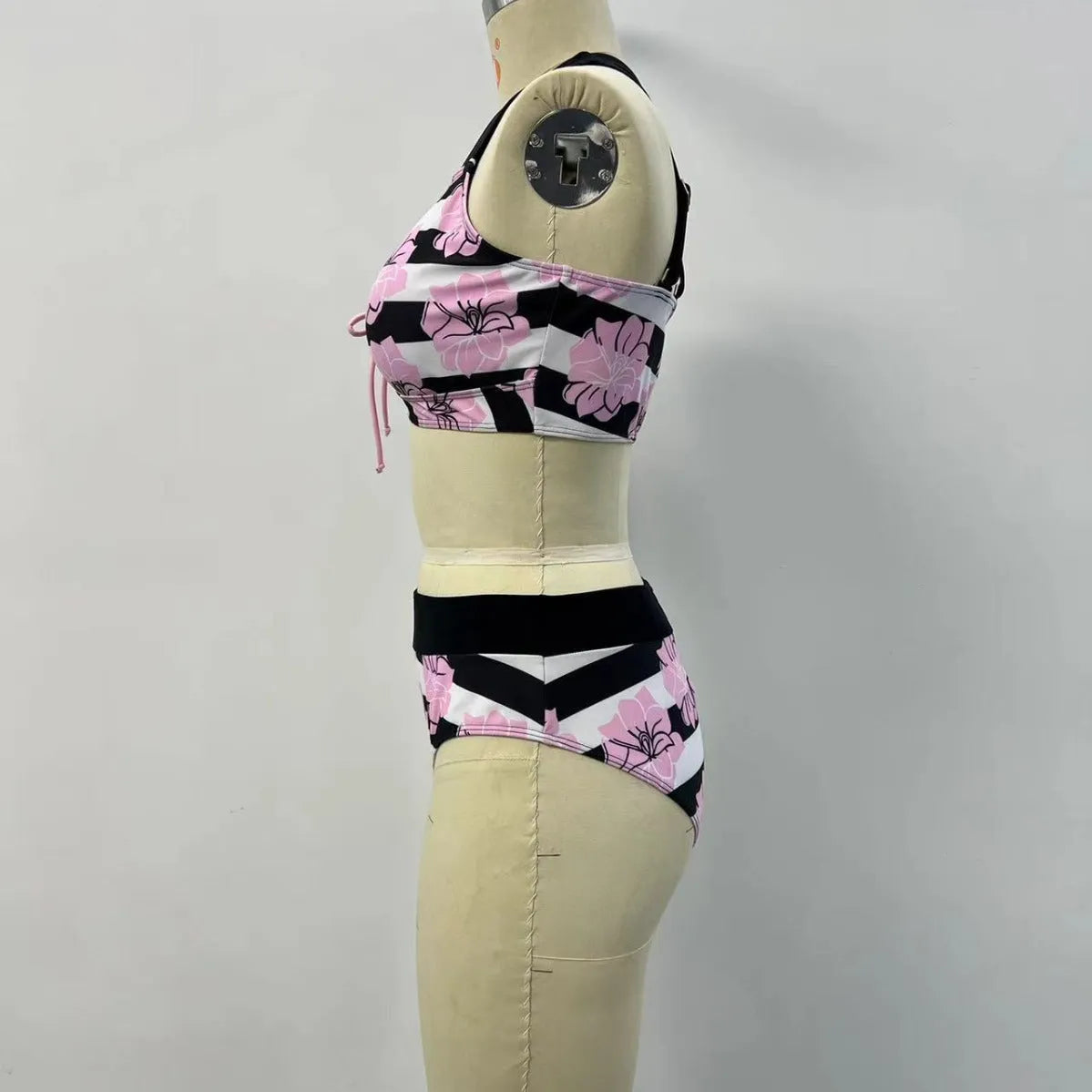 Black women's high-waisted bikini with belly coverage slimming design and split bottom style