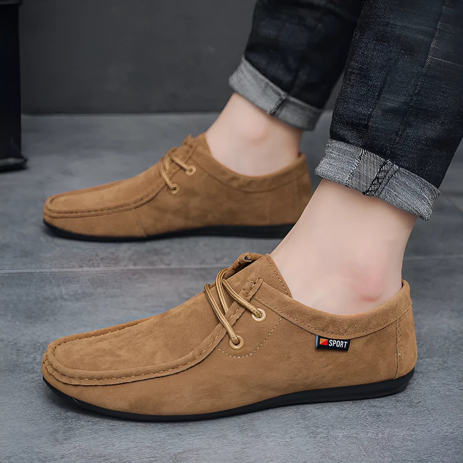 Men's black slip-on loafers with soft sole, round toe, and stitching detail on a neutral background