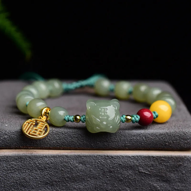 Natural Hetian jade bracelet with cinnabar and beeswax beads featuring animal modelling