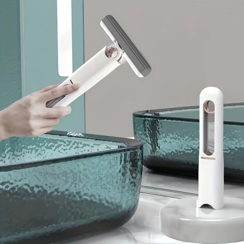 Portable self-squeeze mini mop with sponge head folded 180° for wringing, compact size for cleaning desk and window