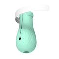 Green silicone cat bathing feet washing set with nylon buckle strap on a surface
