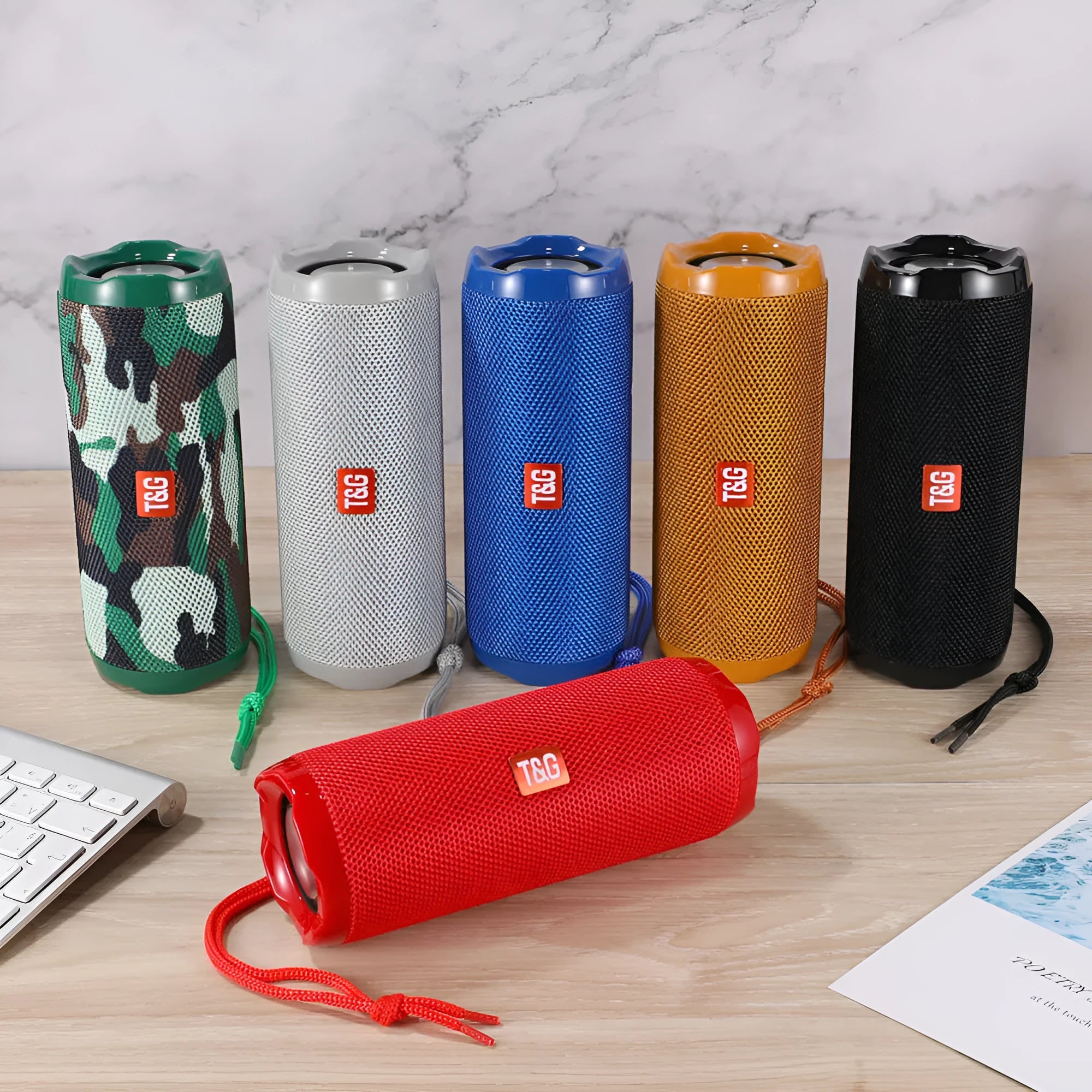 Fabric portable Bluetooth speaker with integrated card holder in multiple colour options.