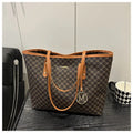 Women's structured PU leather shoulder bag in street-trend style with sewing thread detail.