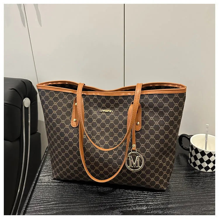 Women's structured PU leather shoulder bag in street-trend style with sewing thread detail.
