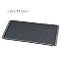 Black silicone car anti-slip mat on dashboard holding a mobile phone L size