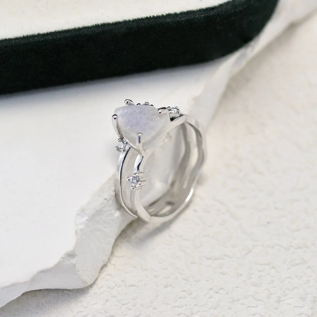 S925 silver irregular triangle moonstone ring in rose gold finish on white background