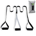 Black suspension training belt with nylon webbing and metal climbing hook on a gym floor