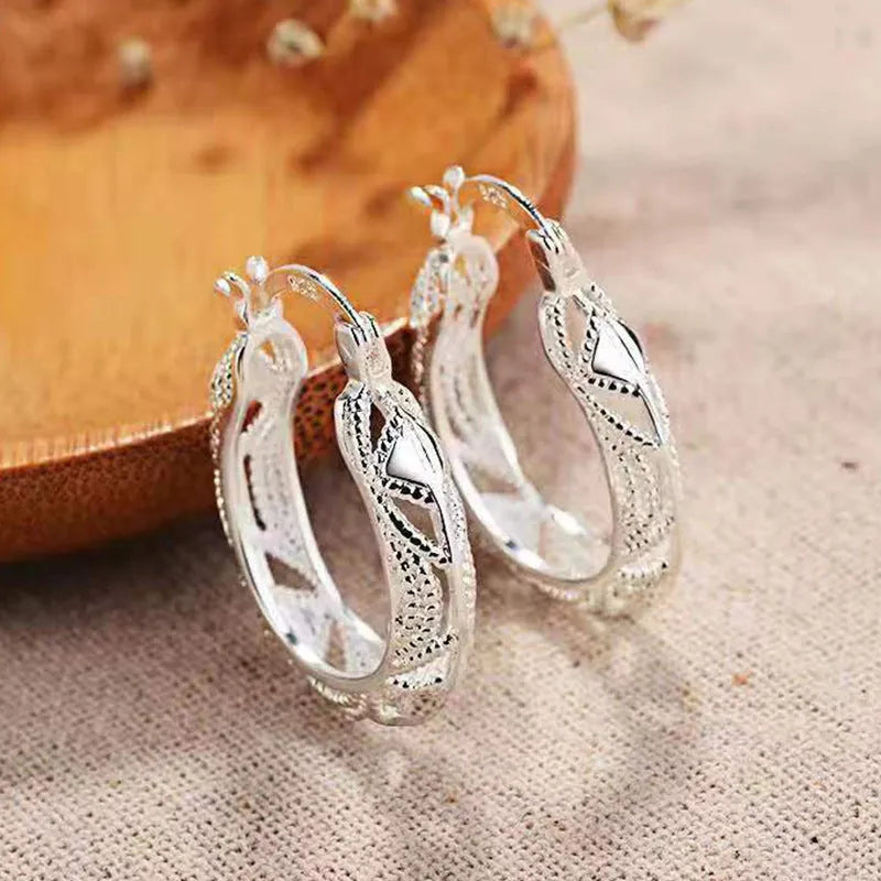 Geometric metal earrings for women with electroplated silver finish, individually packed.