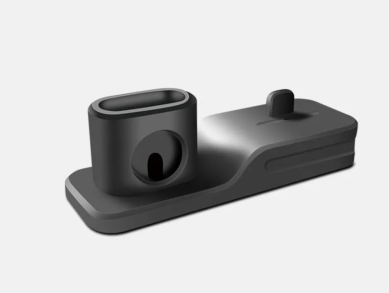 Black silicone 3-in-1 charging station for Apple iPhone, iWatch and AirPods on a desktop