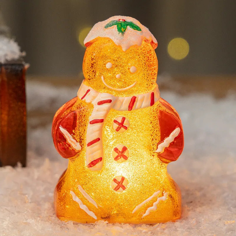 Glowing plastic gingerbread man snowman Christmas ornament with a choice of scarf colours on a festive background.