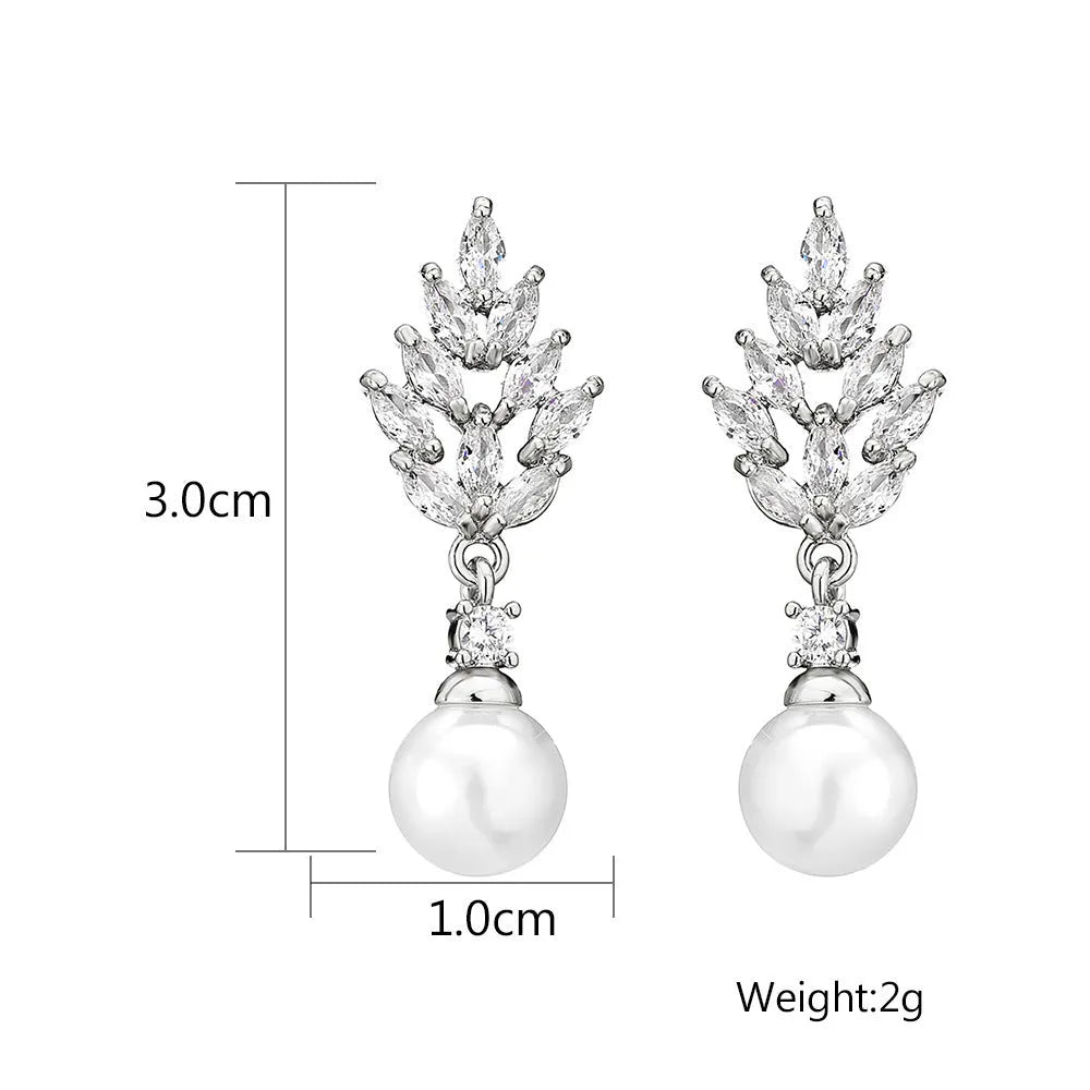 Gold, platinum, and rose gold plated geometric flower earrings with micro-inlaid zircon and pearl details.