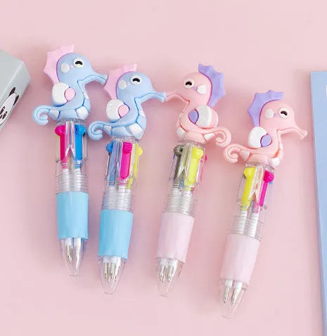 Cartoon four-colour press ballpoint pen with 0.7mm tip in random cute design