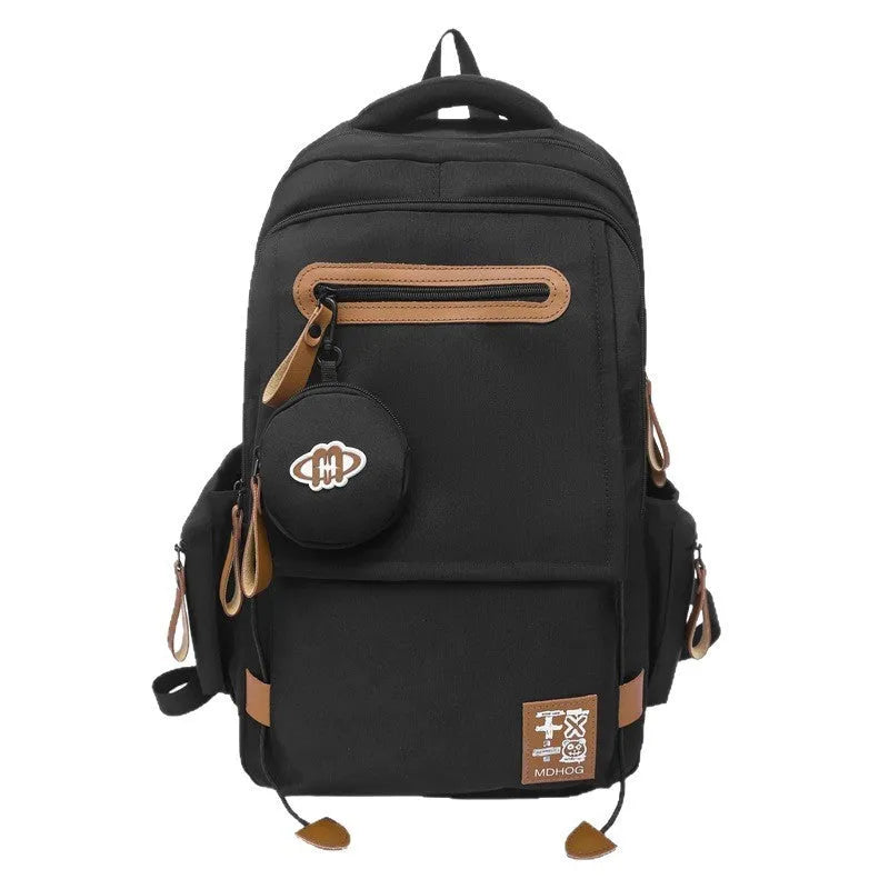 Large black waterproof nylon travel backpack with contrast stitching, shown with a 20-35L capacity.