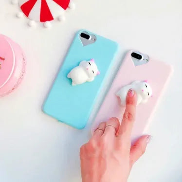 Soft pink silicone iPhone case with a 3D cartoon cat design on the back.