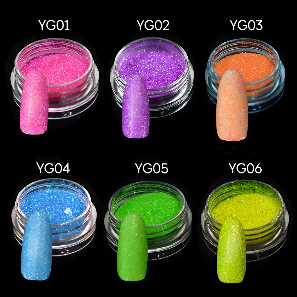 Six 1g pots of neon nail glitter powder in blue, green, orange, pink, purple, and yellow colours on a white background