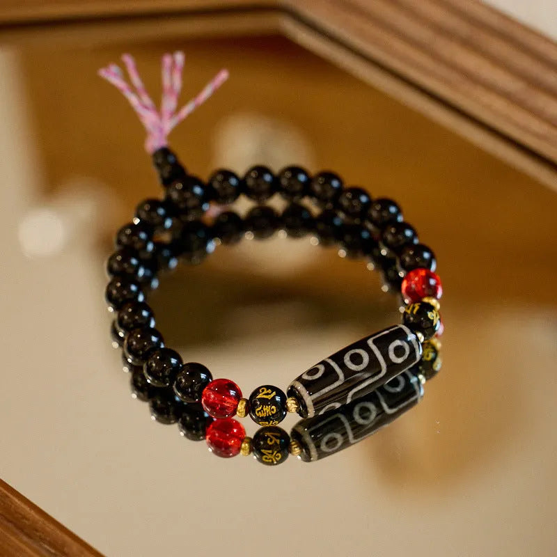 Handmade agate Dzi bead bracelet with 8mm beads in a Tibetan ethnic style.