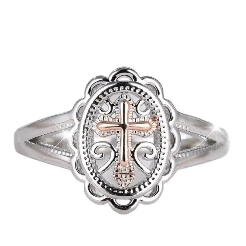 Silver electroplated alloy ring with detailed cross and lace design for women.