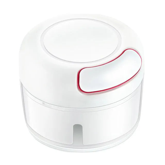 White and silver manual food chopper with stainless steel blades on a kitchen countertop.
