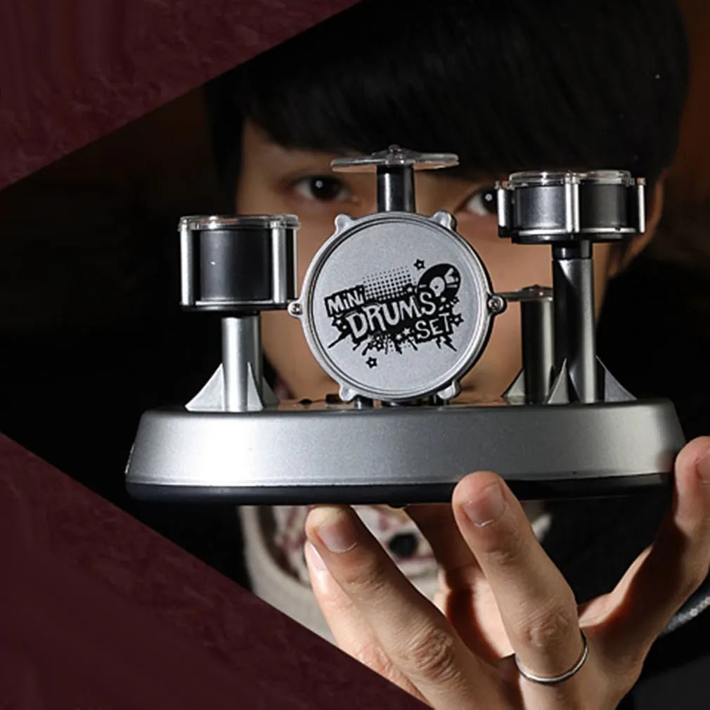 Silver creative finger touch mini drum musical toy with plastic body and finger tapping surface