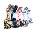 Double knot cotton rope dog toy on neutral background showing two rope knots and loose ends