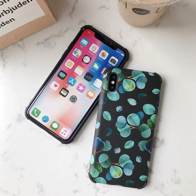 Black silicone iPhone case with leaf pattern texture and raised camera protection rim