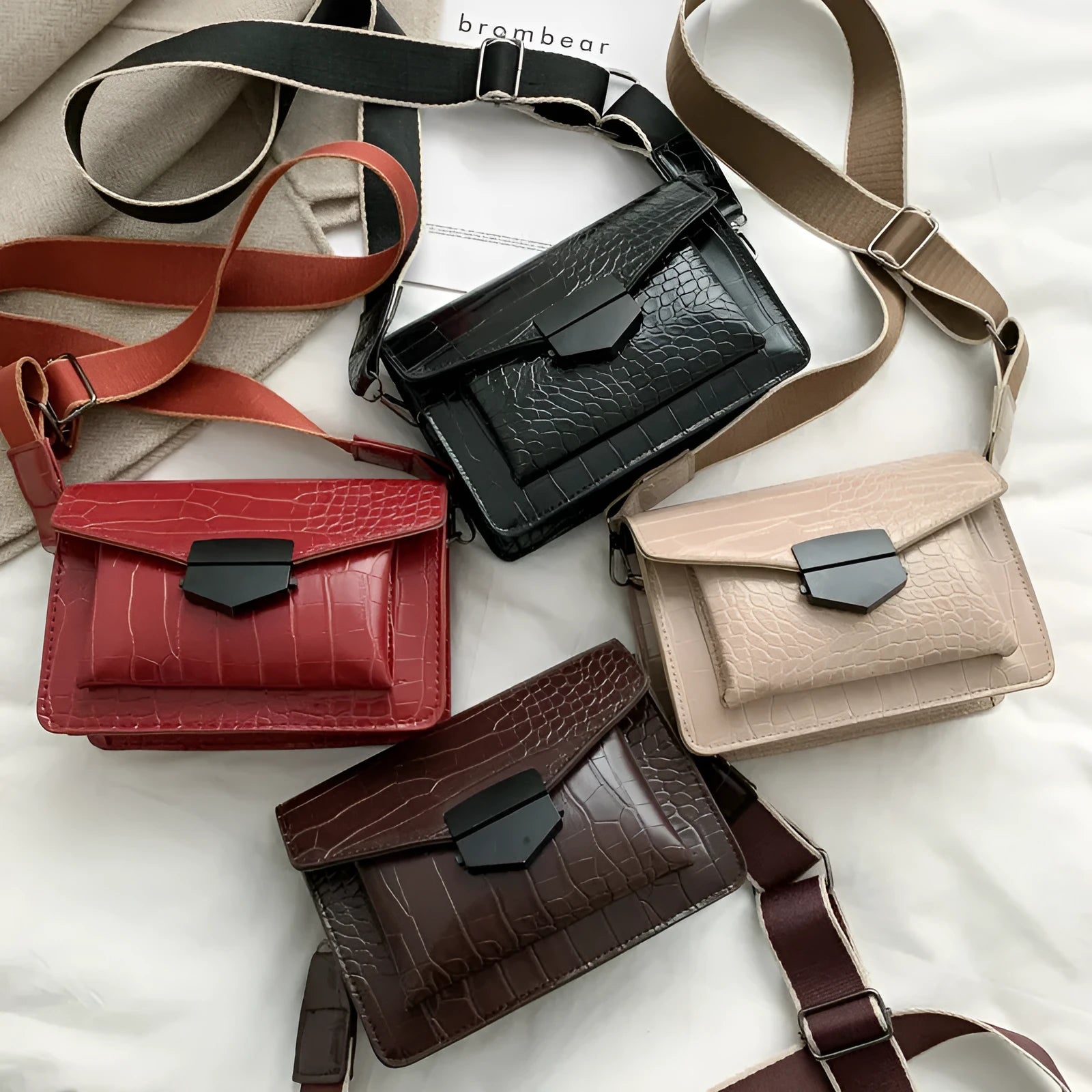 Vintage PU leather crossbody bag in black, shown with a mobile phone and wallet inside