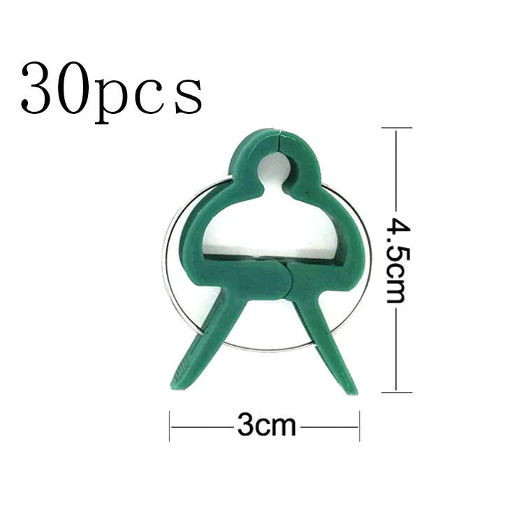 Green plastic and zinc plant fixing clips, showing large and small sizes for garden vine support.